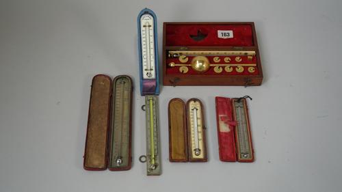 A small Cary thermometer, 19th century, silvered rectangular plate, glass vile in a red leather case (12.5cm), a larger similar thermometer by King &