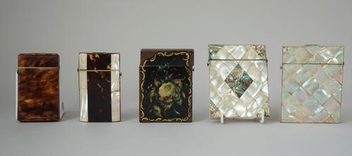 Two Victorian mother-of-pearl visiting card cases, two Victorian tortoiseshell visiting card cases and one further visiting card case, with foliate pa