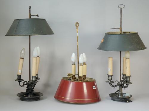 A 20th century French gilt brass Bouillotte lamp with red tole shade, the base in the form of three dolphins, adapted 55.9cm high and two more Bouillo