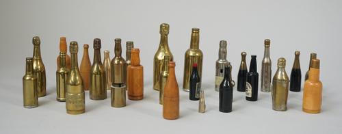 A collection of novelty 'wine botte' shaped gadgets, early 20th century, including; five corkscrews (9.5cm), seven fruitwood or plastic dice container