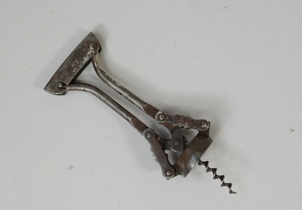 A Goliath type corkscrew marked 'GEHA', Patentamt Gesch Patented - Brevete, steel body, traces of nickel, wire helix.