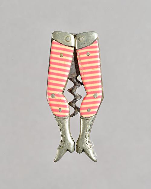 A pair of German novelty 'Lady's legs' corkscrew by Graef & Schmidt, pink and white stripes, full leg, stamped 'Graef Schmidt' (6.6cm) and another sim