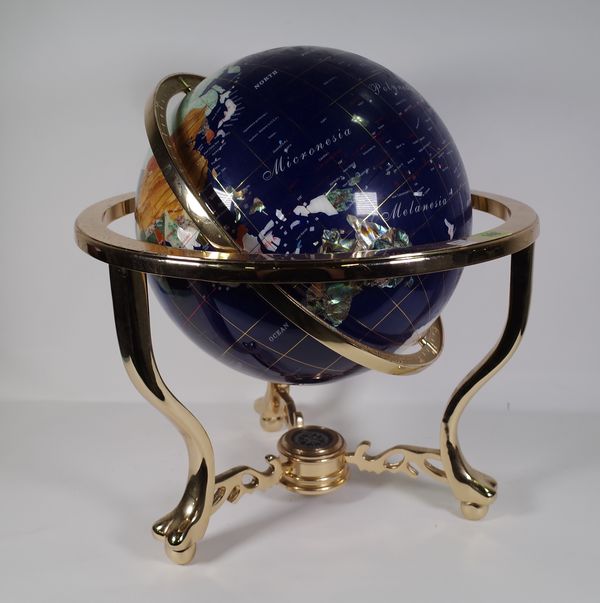 A 20th century specimen stone table globe, on a brass metal base, approx. 48cm wide x 45cm high.