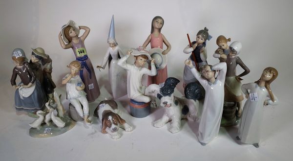 A group of thirteen Lladro figures and one Nao figure, (14). S6T