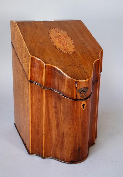A George III inlaid mahogany slope top, serpentine fronted knife box with later interior, 19cm wide x 30cm high.