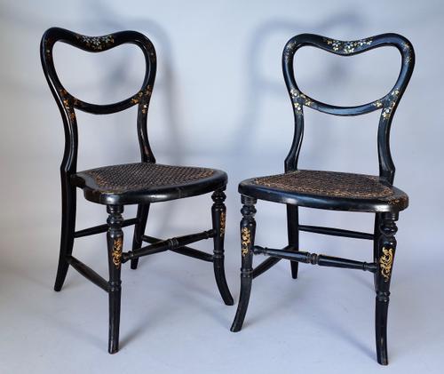 A pair of Victorian parcel gilt mother-of-pearl inlaid papier mâché child's kidney back chairs, on splayed turned supports, 32cm wide x 61cm high.