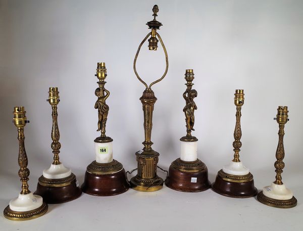 A quantity of 20th century gilt metal table lamp bases and a group of turned wooden wall light mounts. S3T