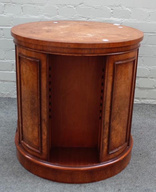 Brights of Nettlebed; a 20th century figured walnut circular revolving bookcase on plinth base, 60cm dia x 62cm high.