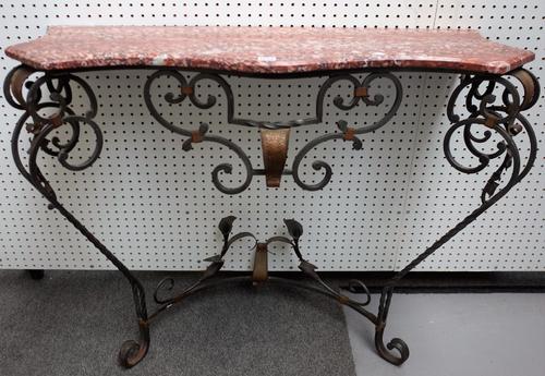 A 20th century French console table, the serpentine marble top over wrought iron base, 106cm wide x 85cm high.