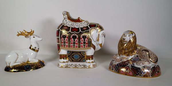 Three Royal Crown Derby Imari paperweights, including a lion, a stag and an elephant, (3). CAB