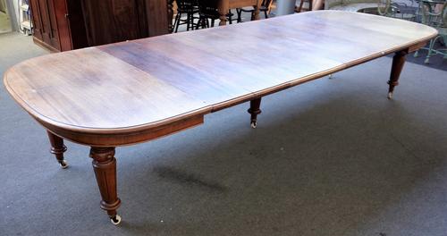 A Victorian mahogany extending dining table on turned fluted supports, five extra leaves, 139cm wide x 142cm long x 372cm fully extended.