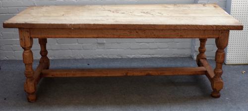 An oak kitchen table, the plank top over end frieze drawer on turned supports and 'H' frame stretcher, 79cm wide x 199cm long.