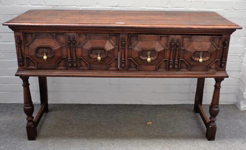 A Charles II style oak dresser base with a pair of geometric drawers, on turned supports, 150cm wide x 89cm high.