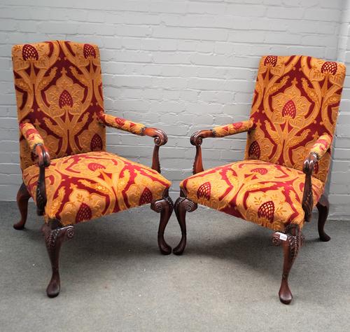 A pair of mid-18th century style open armchairs, on carved mahogany cabriole supports, 70cm wide x 115cm high.