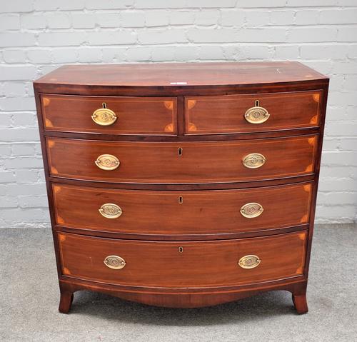 An early Victorian inlaid mahogany bowfront chest of two short and three long graduated drawers, on splayed bracket feet, 96cm wide x 94cm high.