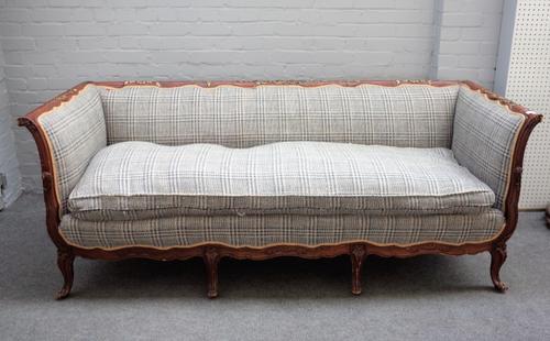 A Louis XV style square back parcel gilt sofa, with foliate moulded frame, on scroll supports, 205cm wide x 79cm high.