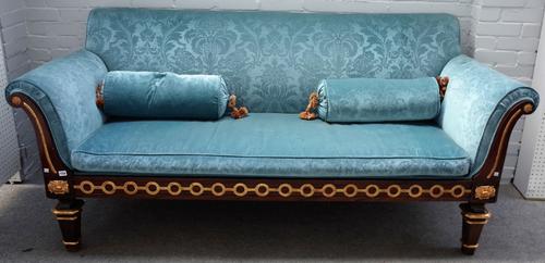 An Empire Revival parcel gilt mahogany sofa with out swept arms, on canted tapering block supports, 220cm  wide x 100cm high.