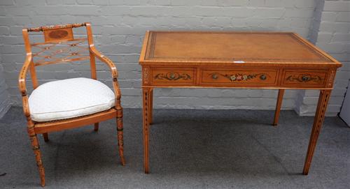 A 20th century floral polychrome painted satinwood three drawer writing desk, on tapering square supports, 107cm wide x 77cm high, together with a mat