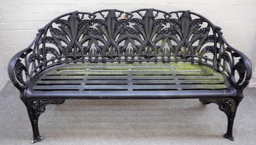 After Coalbrookdale; Lily of the Valley pattern, a black painted cast metal garden bench, 154cm wide x 85cm high.