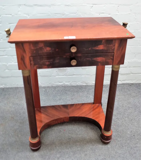 An Empire Revival gilt metal mounted mahogany work table with fitted interior over single drawer on turned supports, 61cm wide x 80cm high.