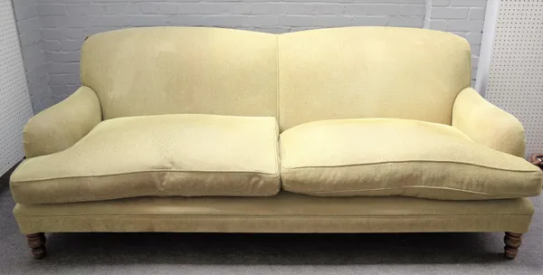 A modern green upholstered double humpback sofa on turned supports, 220cm wide x 85cm high.