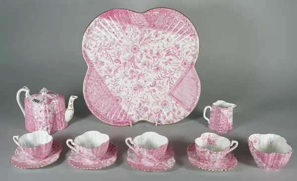 A Wileman & Co. bone china cabaret set, late 19th century, printed in deep pink with panels of flowers and brocade patterns, comprising; a shaped squa