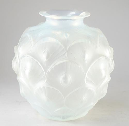 A Sabino opalescent glass vase, 20th century, relief moulded with peacock feathers against a globular ground, etched 'Sabino France' to base, 19cm hig