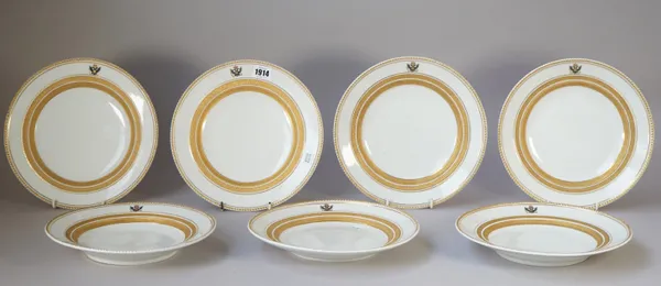 Seven K.P.M, Berlin plates, dated 1835, with eagle monogram and gilt foliate banding, printed marks, 25.5cm dia, (7). 4425
