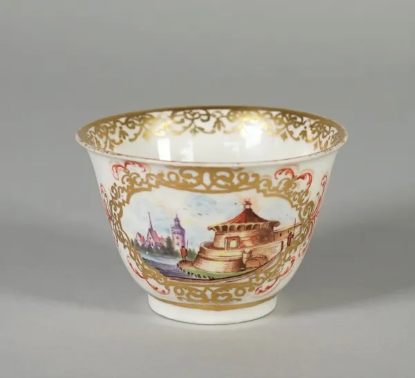 A Meissen porcelain teabowl, circa 1730-40, possibly Hausmaler decorated, painted on the exterior with panels of a water mill and buildings within gil