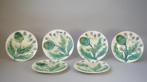 Six Continental majolica glazed plates, probably French, late 19th/ early 20th century, each moulded with artichokes and asparagus, 24cm diameter, (6)
