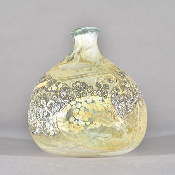 Sam Herman (born 1936), a studio glass vase, dated 1971, bulbous form with short neck and wavy rim, steaked in white, cream and brown and with a parti
