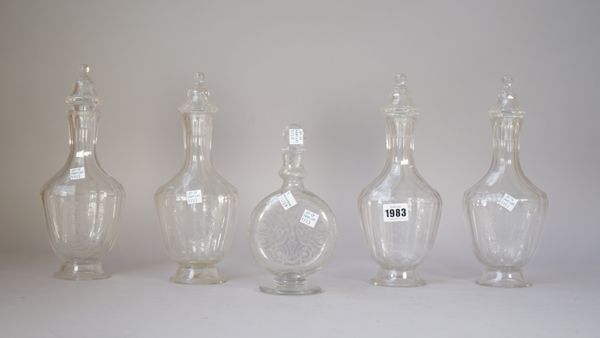 A set of four urn shaped glass decanters and stoppers, 19th century, probably German or Austrian, each engraved with the initials `JBH', (a.f), 27cm.