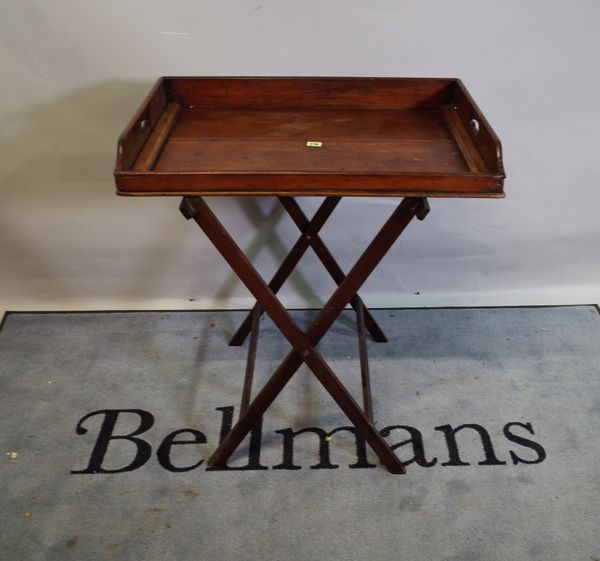 A late 19th century mahogany butlers tray with galleried top and folding stand, 76cm wide x 85cm high.