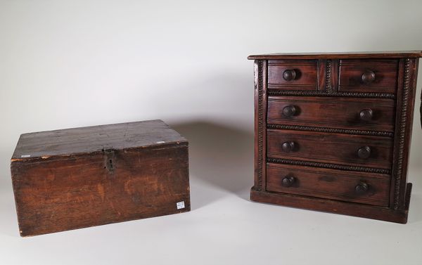 An early 20th century stained pine table top chest of two short and three long drawers, 37cm wide x 36cm high, an early 19th century stained pine lift