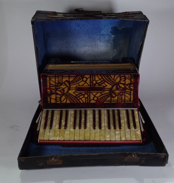 An early 20th century cased leather piano accordion, 47cm wide x 41cm high. S4B