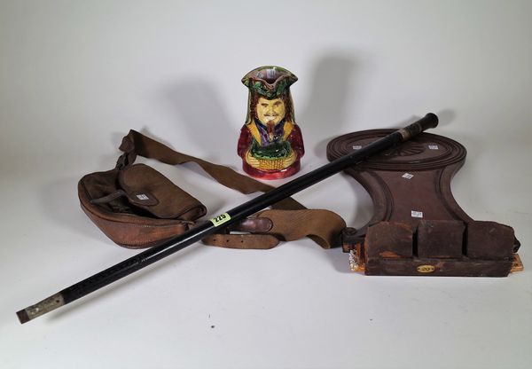 A late 19th century Indian sword stick, a Regency mahogany hall chair back, a cartridge bag and a Toby jug, (4). S1T