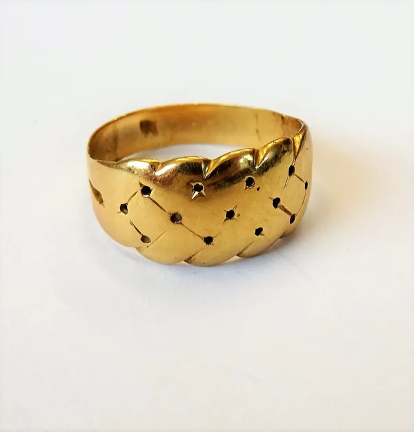 A gold keeper style ring, with pierced decoration, ring size N and a half, weight 5.5 gms,