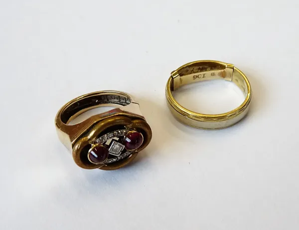 A 9ct gold and gilt metal, cabochon ruby and diamond set ring, mounted with a square cut diamond to the centre, between two cabochon rubies and otherw