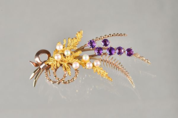 A 9ct gold, amethyst and cultured pearl brooch, designed as a spray, Birmingham 1967, gross weight 9.3 gms, with a case. Illustrated.