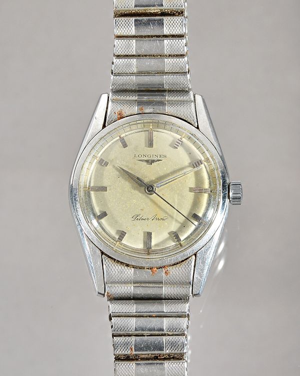 A Longines Silver Arrow steel circular cased gentleman's wristwatch, the signed silvered dial with silvered baton numerals and with centre seconds, on