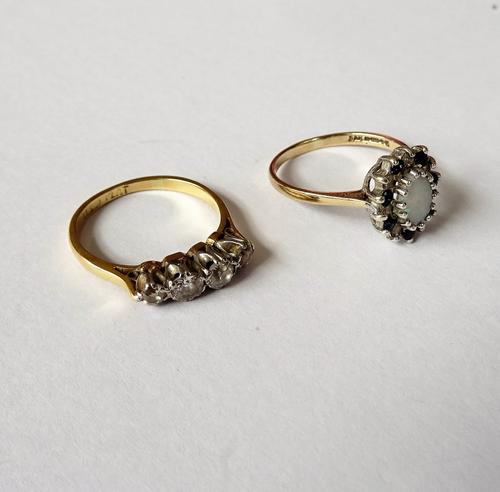 A gold and platinum, diamond set four stone ring, mounted with a row of cushion shaped diamonds, detailed 18 CT PLAT, ring size M and a half and a 9ct