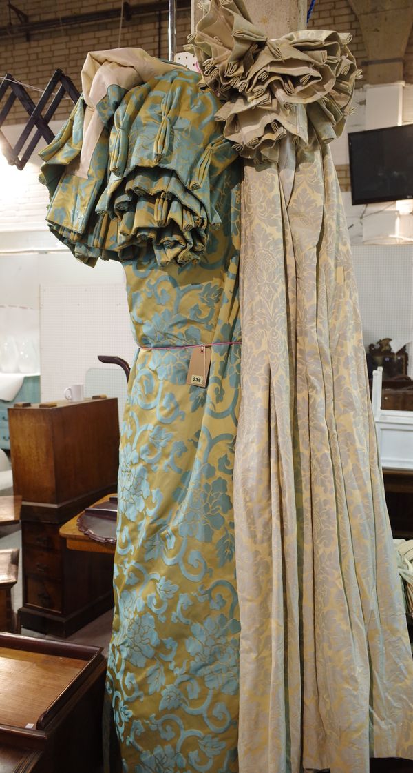 Designers Guild; a pair of lined curtains with gilt and turquoise foliate design, 200cm wide x 240cm drop, and another similar pair, 86cm wide x 210cm