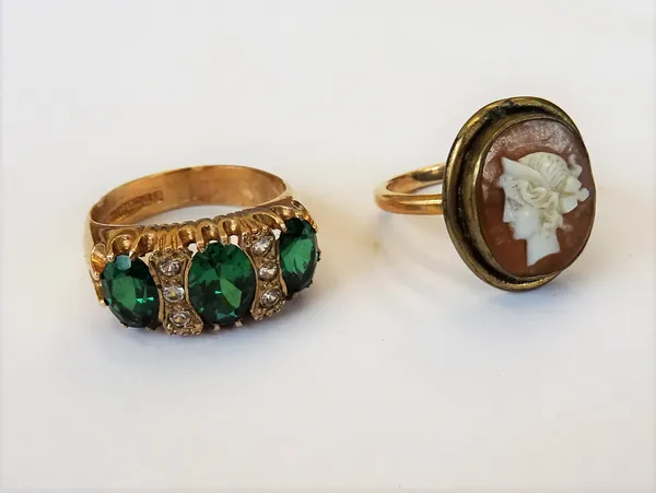 A 9ct gold, green and colourless gem set ring, Birmingham 1972, ring size O and a half, gross weight 5.2 gms.and a gold and gilt metal ring, mounted w