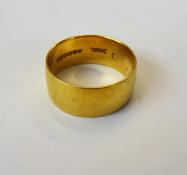 A 22ct gold wide band wedding ring, Birmingham 1970, ring size R, weight 7.7 gms.