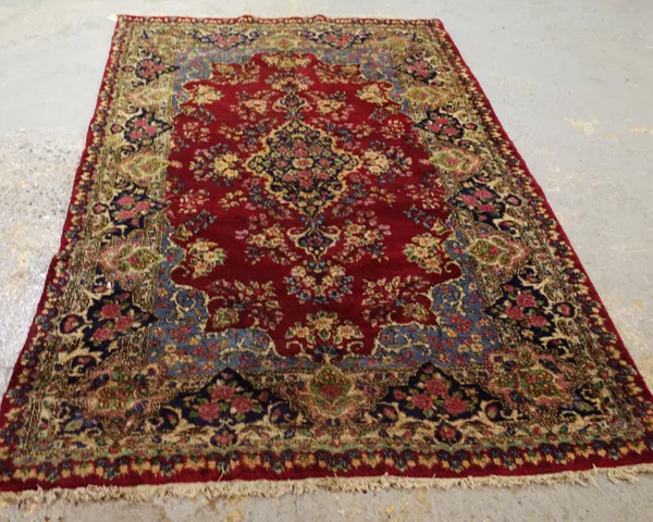 A Kerman rug, 227cm x 140cm.
