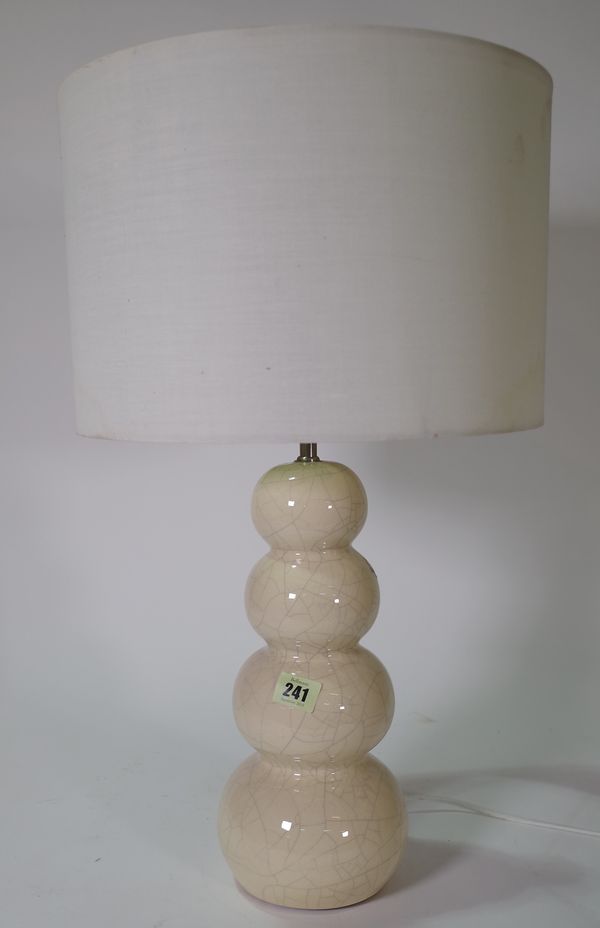 Lighting, comprising; a 20th century cream ceramic crackle glaze table lamp with white silk shade and a white painted standard lamp, 180cm high, (2).