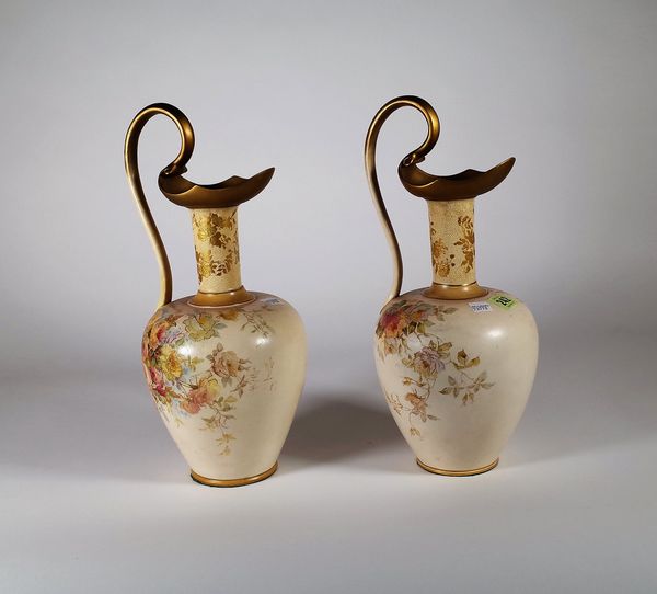 Royal Doulton Burslem; a pair of vases formed as ewers decorated with flowers, 35cm high, (2). S1T