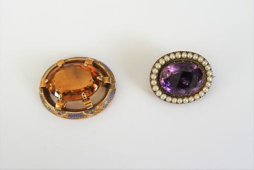 A gold backed, amethyst and half pearl set oval brooch, mounted with the foil backed oval cut amethyst to the centre, within a surround of half pearls