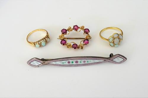 An 18ct gold, opal and diamond ring, mounted with three opals and with two pairs of diamonds mounted at intervals, Birmingham 1907, ring size N, a gol