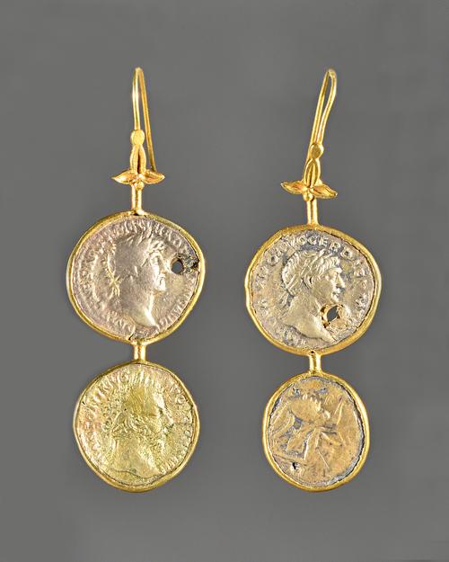 A necklace and a pair of earrings formed as a row of mounted gilt, mostly Roman coins, with a pair of pendant earrings, fitted with two coins to each